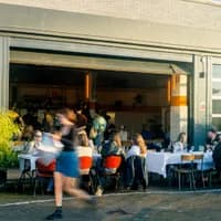 Bar Dancing Multipla people sitting on the terrace during the day
