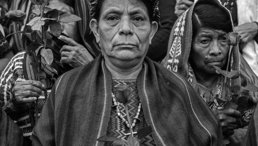 Title: The Trials of the Achi Women
Credit: © Victor J. Blue, for The New York Times Magazine
Caption: Doña Paulina Ixpatá Alvarado stands with other Achi women outside a Guatemala City court. That afternoon, three ex-civil defense patrollers were found guilty of rape and crimes against humanity and sentenced to 40 years in prison each. Guatemala City, Guatemala, 30 May 2025.
Story: For four decades, a group of Indigenous Maya Achi women in Rabinal lived in the same communities as the men who had raped them, sometimes as neighbors. Guatemala’s civil war led to the genocide of thousands of Maya Achi people by the military and local state-backed paramilitary forces, who used sexual violence as a systematic weapon to subjugate Indigenous communities. In 2011, 36 women broke their silence, launching and winning a 14-year legal battle against their abusers. Their collective resilience is transforming a legacy of wartime impunity into a historic victory for justice.