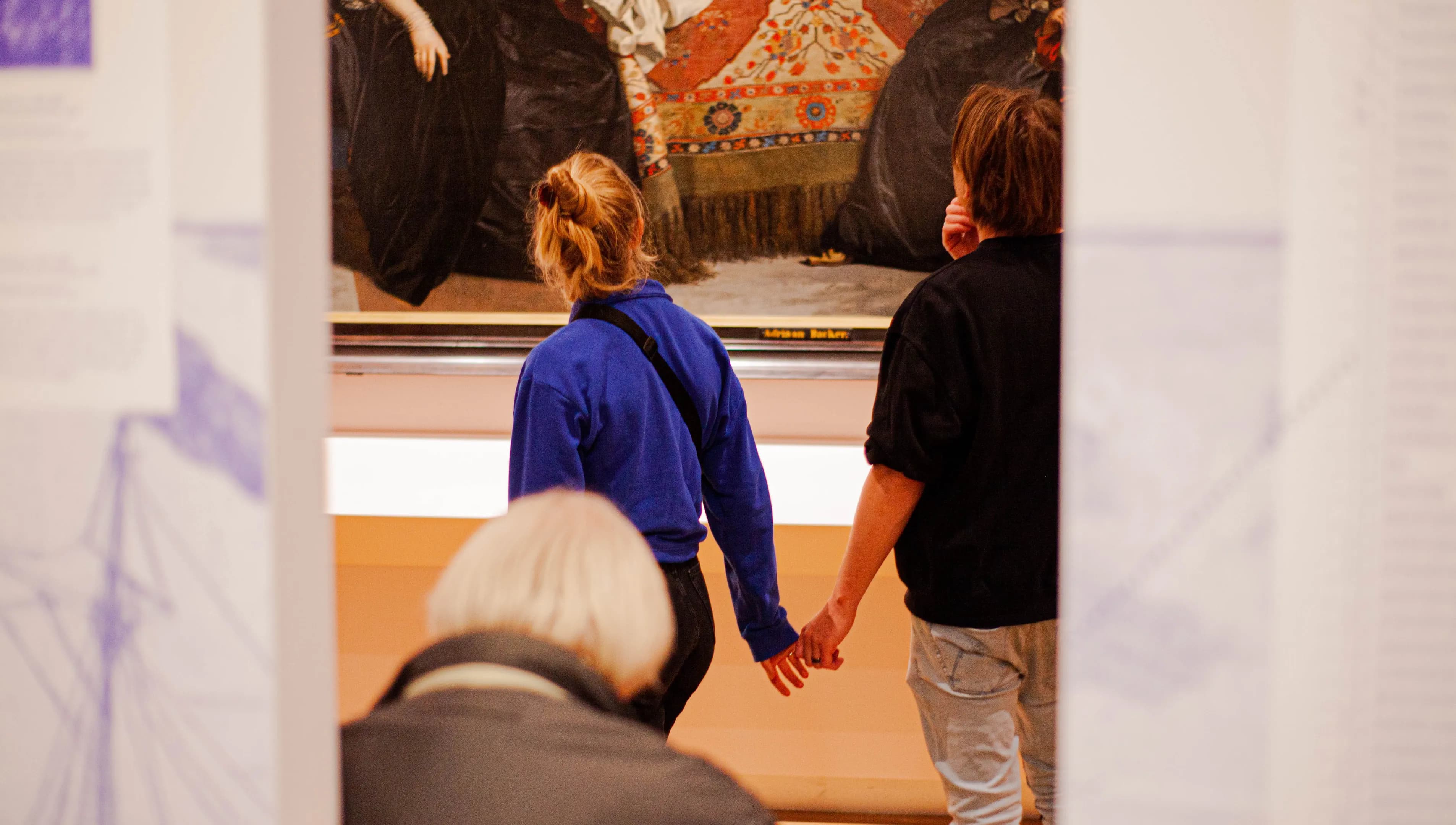 Couple checking out the Panorama Amsterdam exhibition at Amsterdam Museum in 2022
