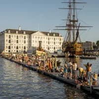 People swimming and sunbathing on the jetty at Marineterrein
