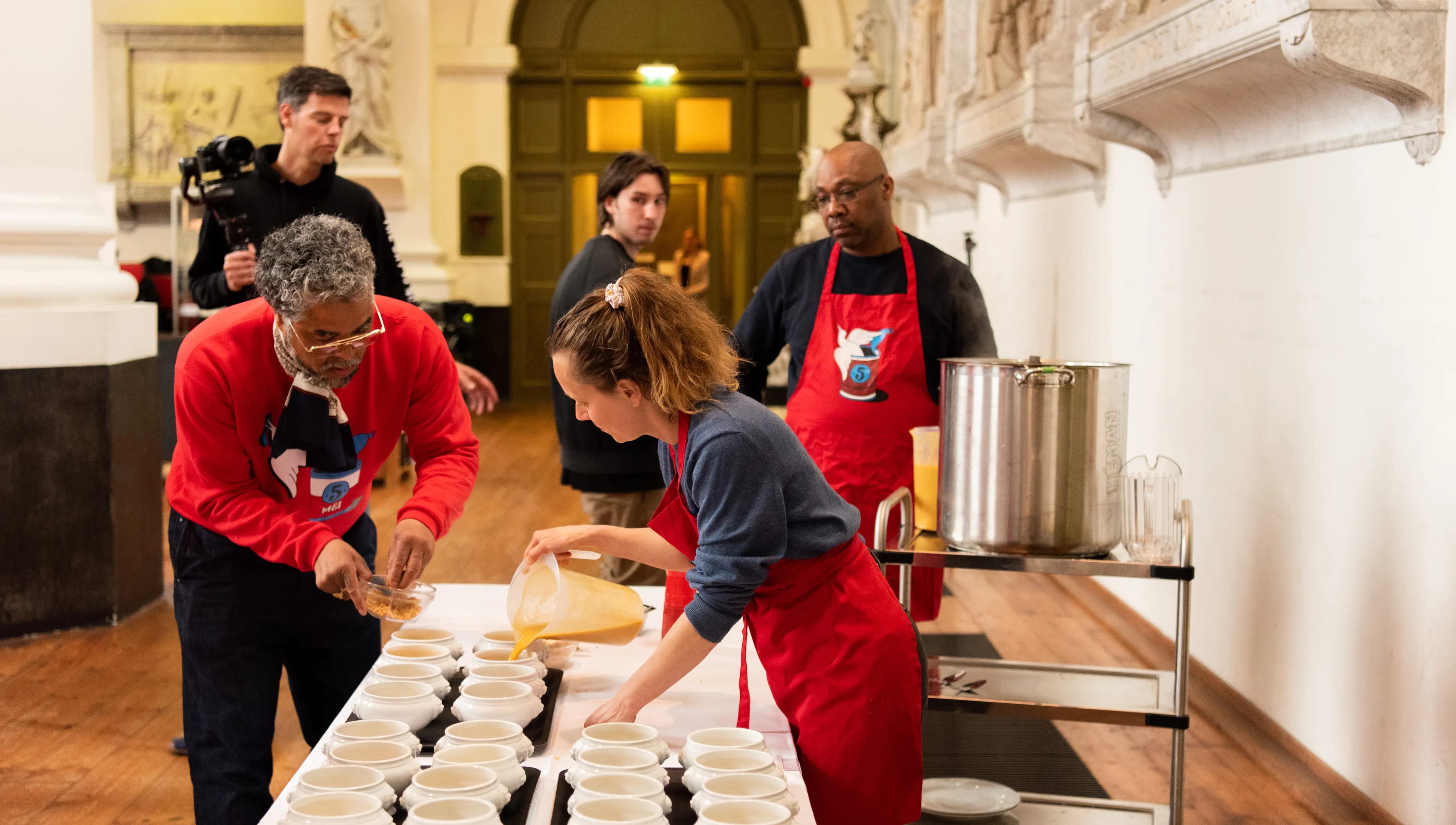 People pouring Vrijheidssoep during the Vrijheidsmaaltijden on 5 mei, may 5th, liberation day meals, bevrijdingsdag.