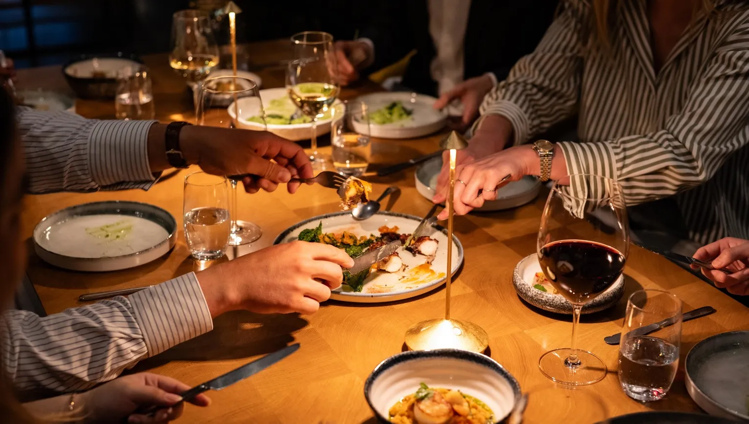 Diners tucking into dishes at ARCA Portugese restaurant at the art'otel