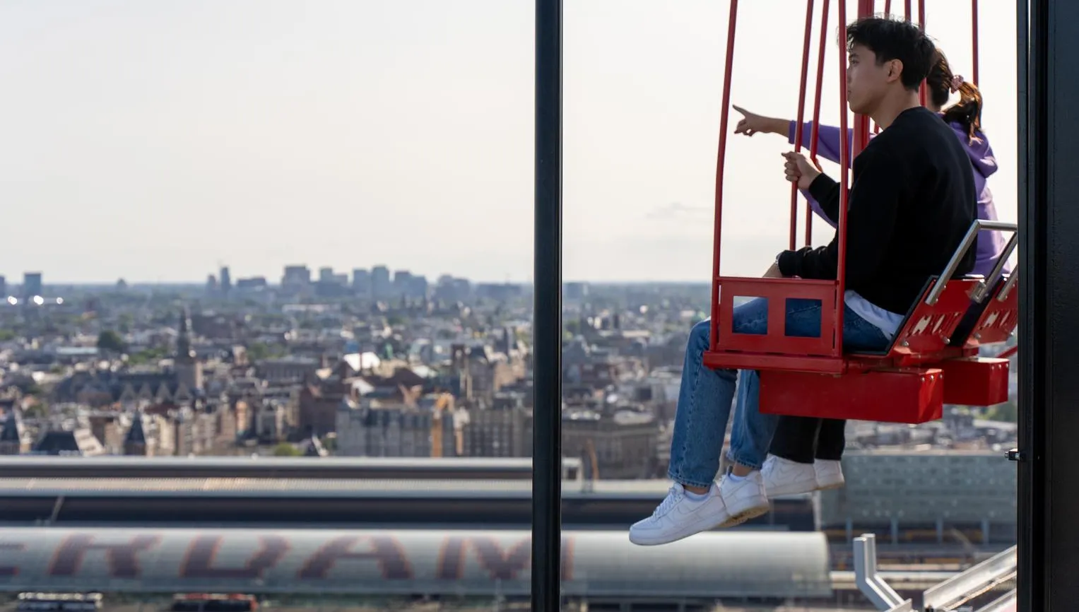 People on the / ADAM Lookout / swings