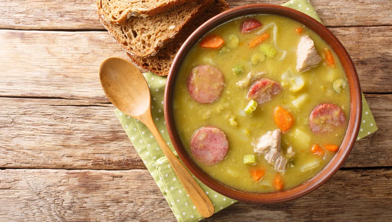 Classic Dutch pea soup erwtensoep, snert closeup in the plate on the table. horizontal top view from above
1873721881
Typically Dutch foods
