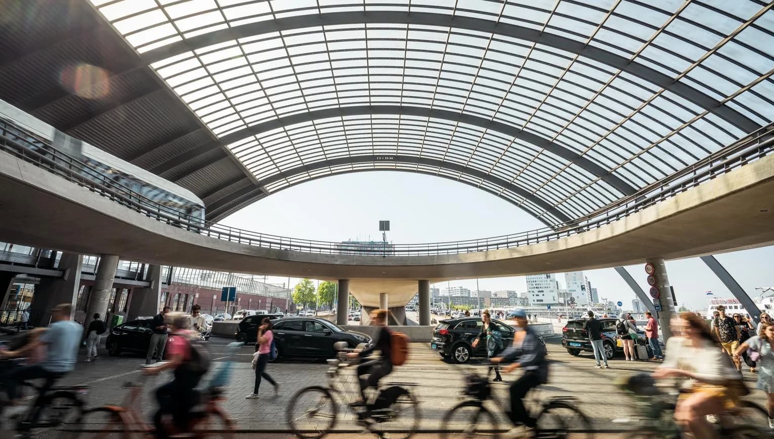 Cyclist at Amsterdam Centraal Station.