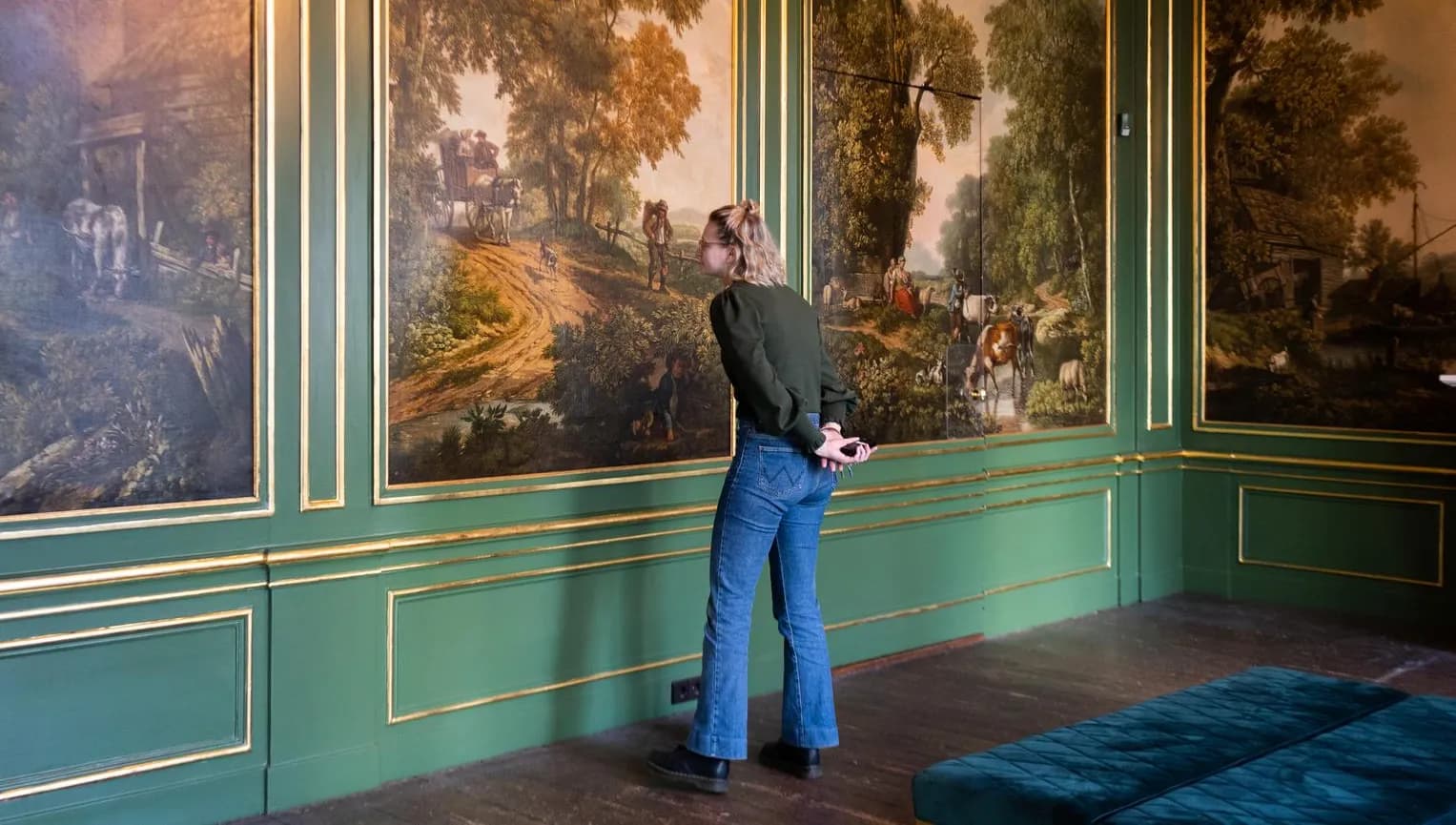 Grachtenmuseum inside, person watching painting