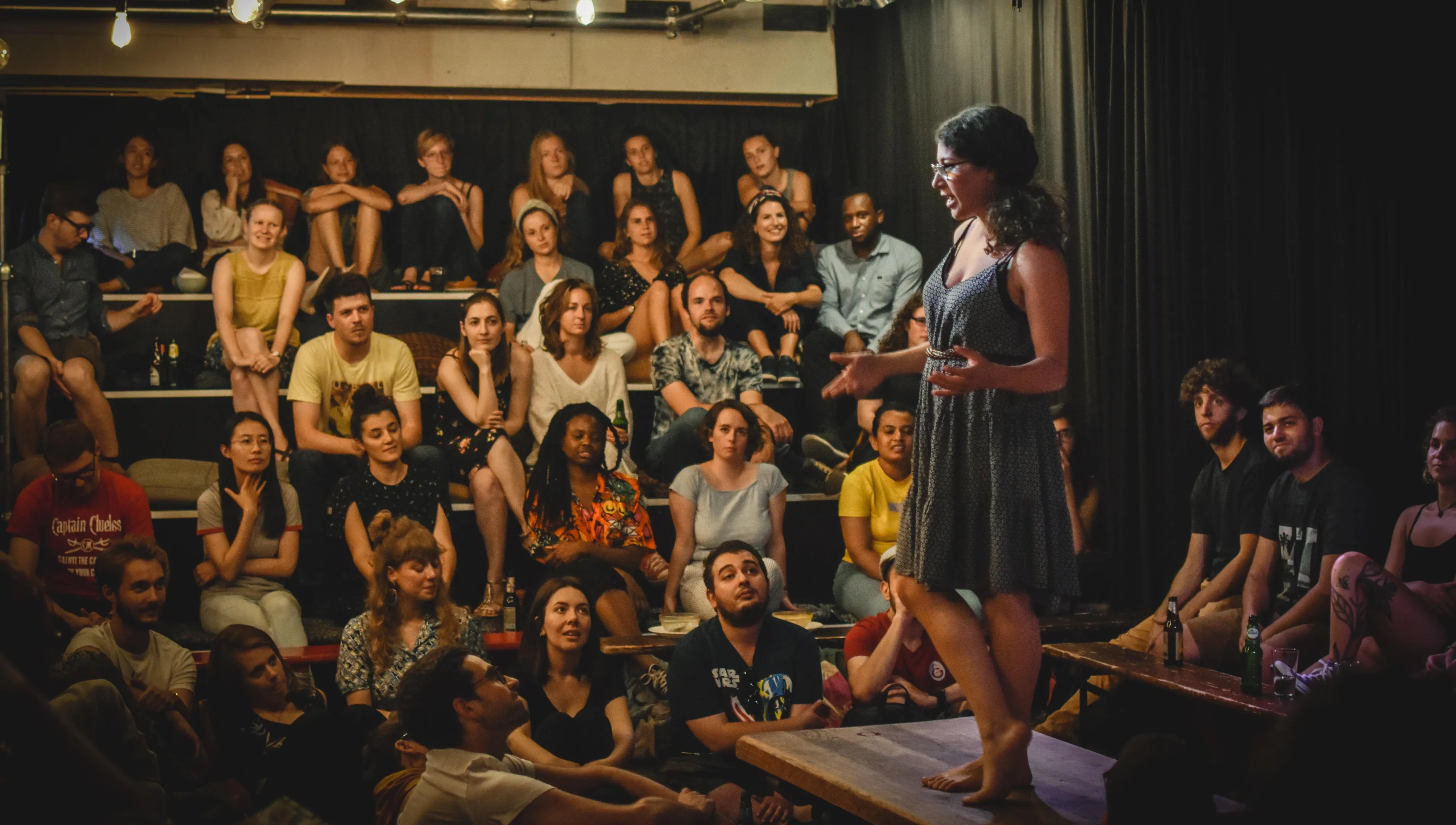 Speaker storytelling on stage at Mezrab