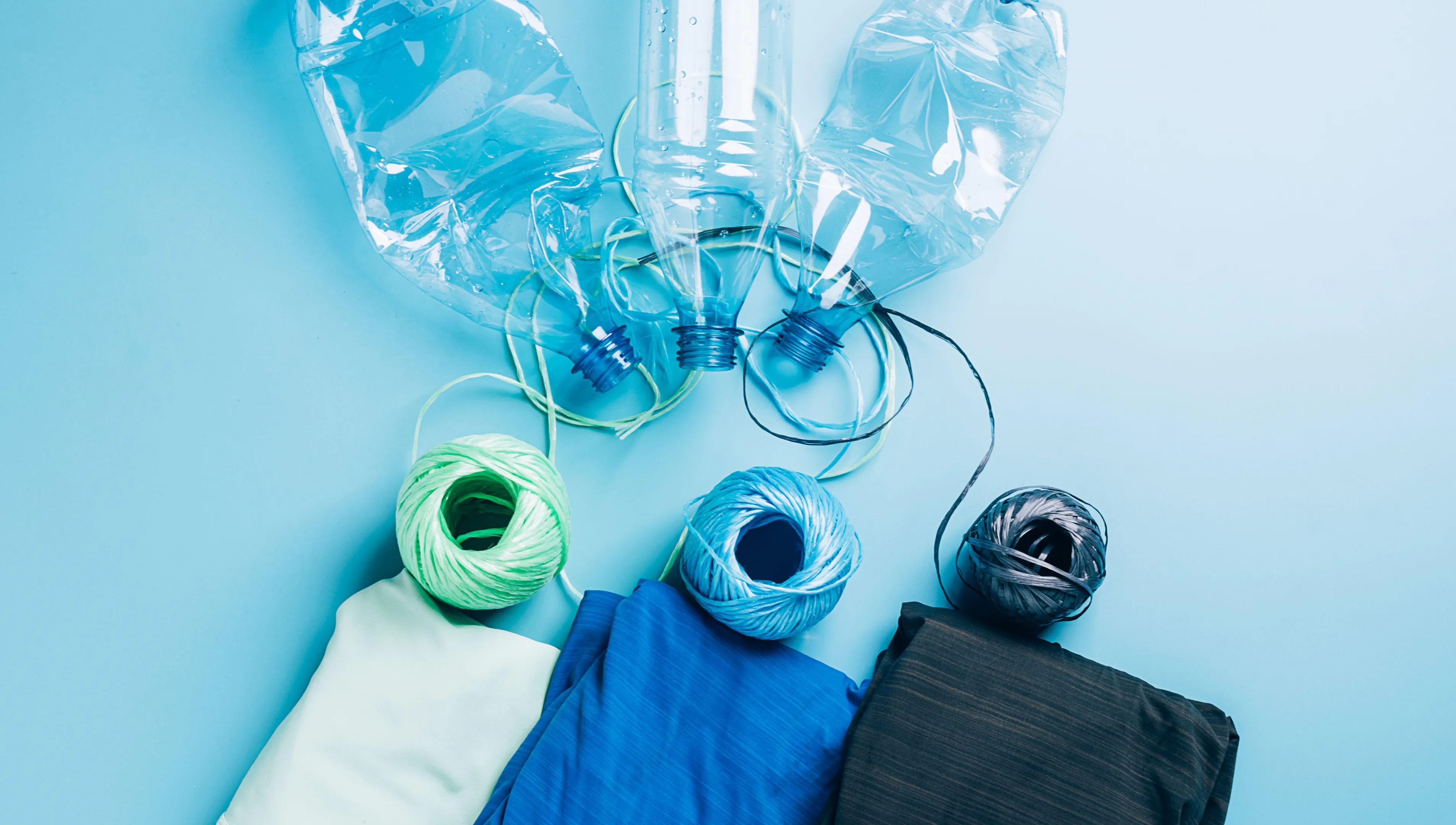 2G7C3TY Polyester fiber synthetic fabrics eco-friendly textile recycled recyclable plastic bottles. Reuse recycling used bottles