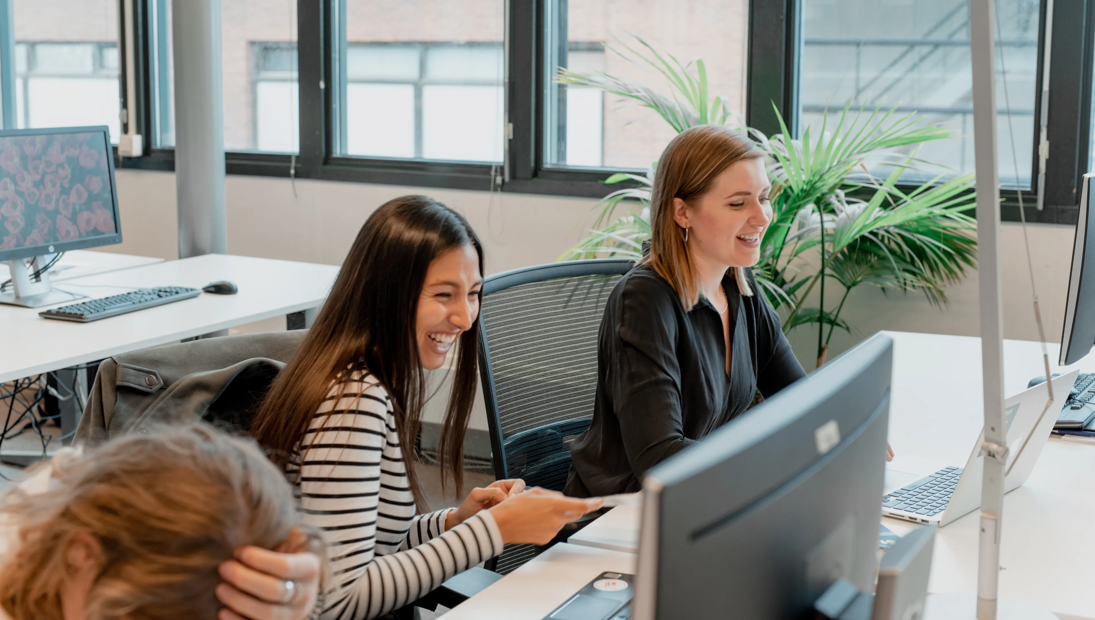 Alexandra Belicova and Kriya Mehta at the office