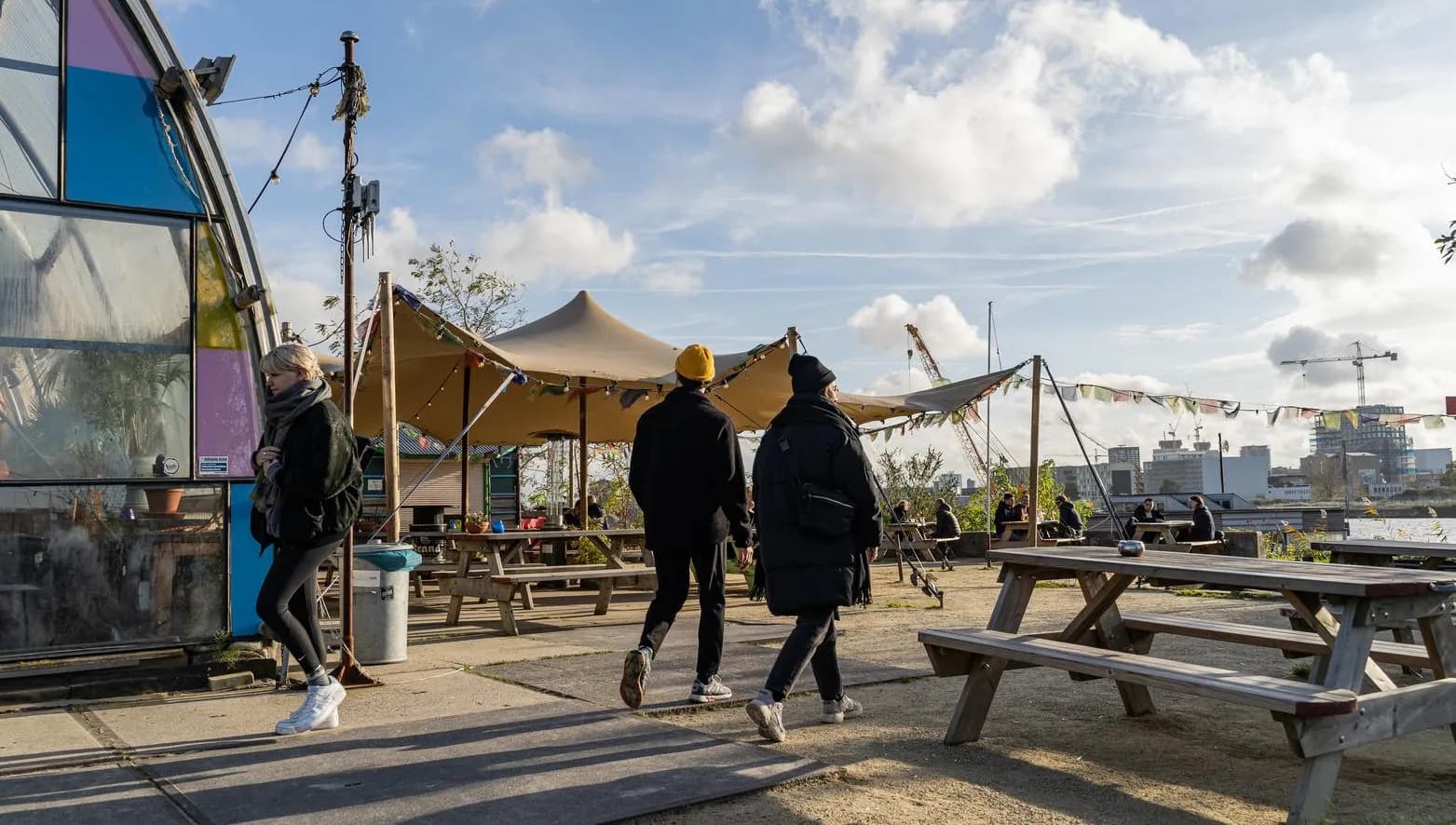 A couple is walking onto the terrace of café-restaurant and cultural hotspot Noorderlicht at NDSM.