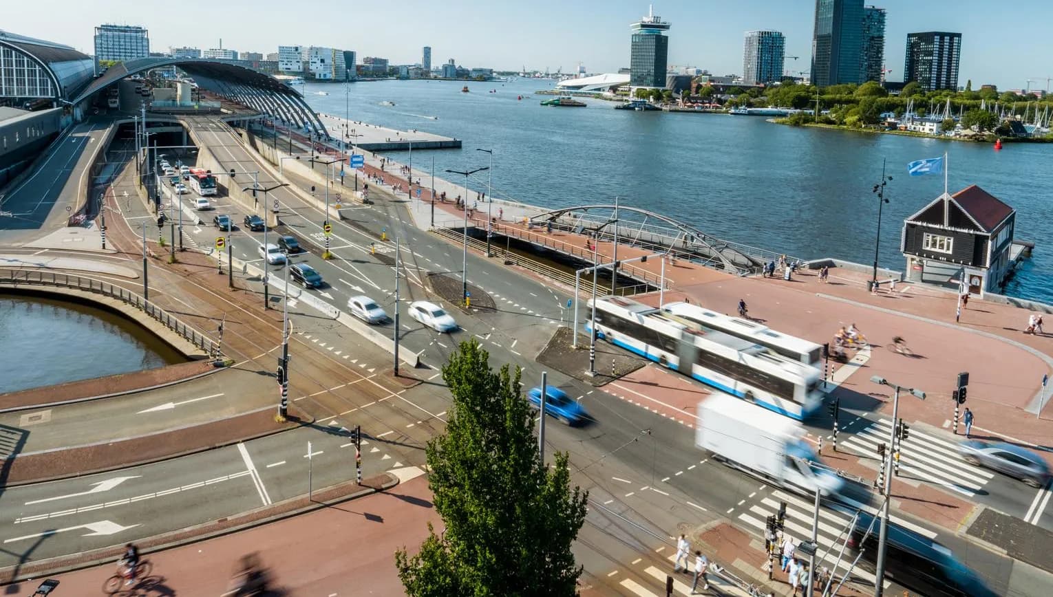 IJ and Amsterdam Centraal Train Station.