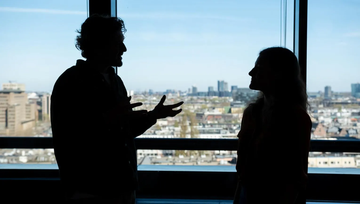Man and woman discussing business.