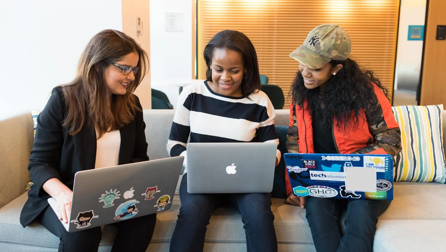 women meeting with computers