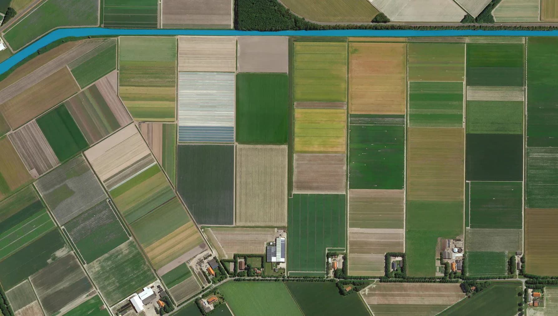 colorful fields bird's eye view, land consolidation and cultivated fields looking down aerial view from above, Amsterdam, Netherlands