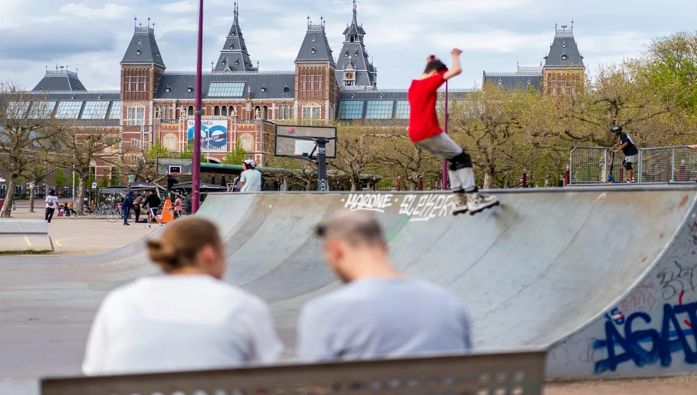 People skating at the Skatepark - Museumplein in spring