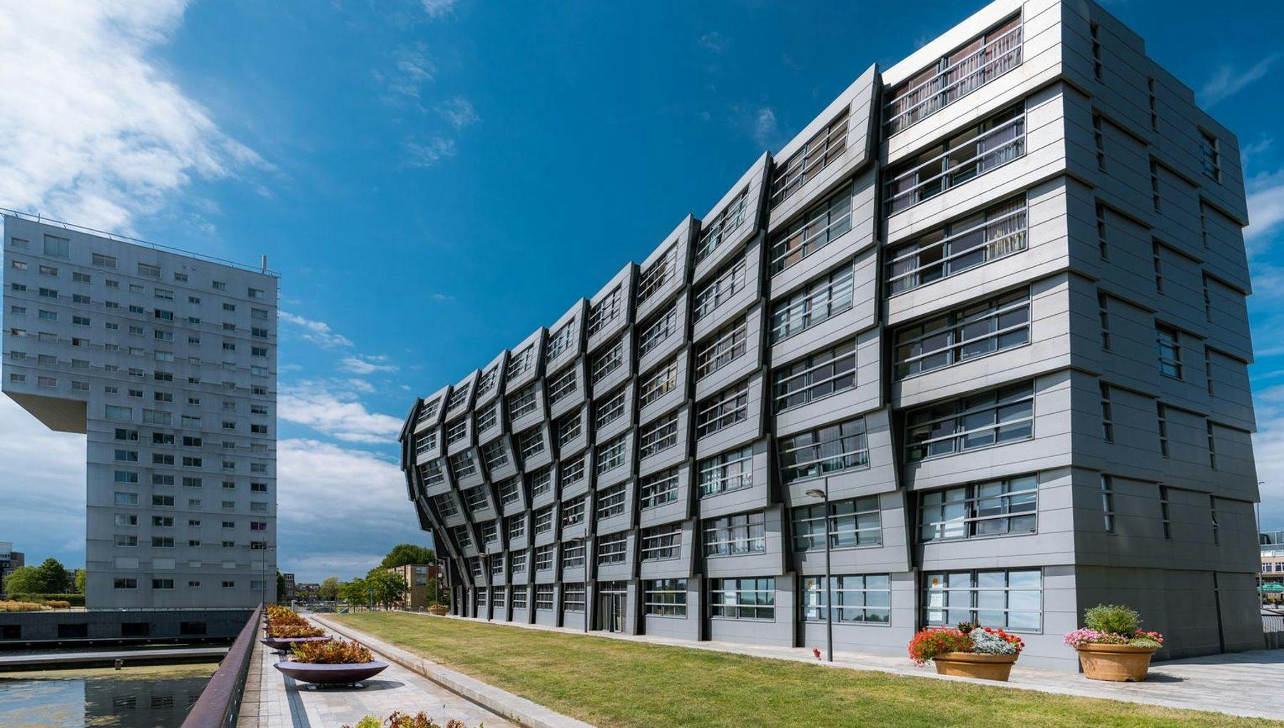This modern flat building in Almere with living spaces is called The Wave.