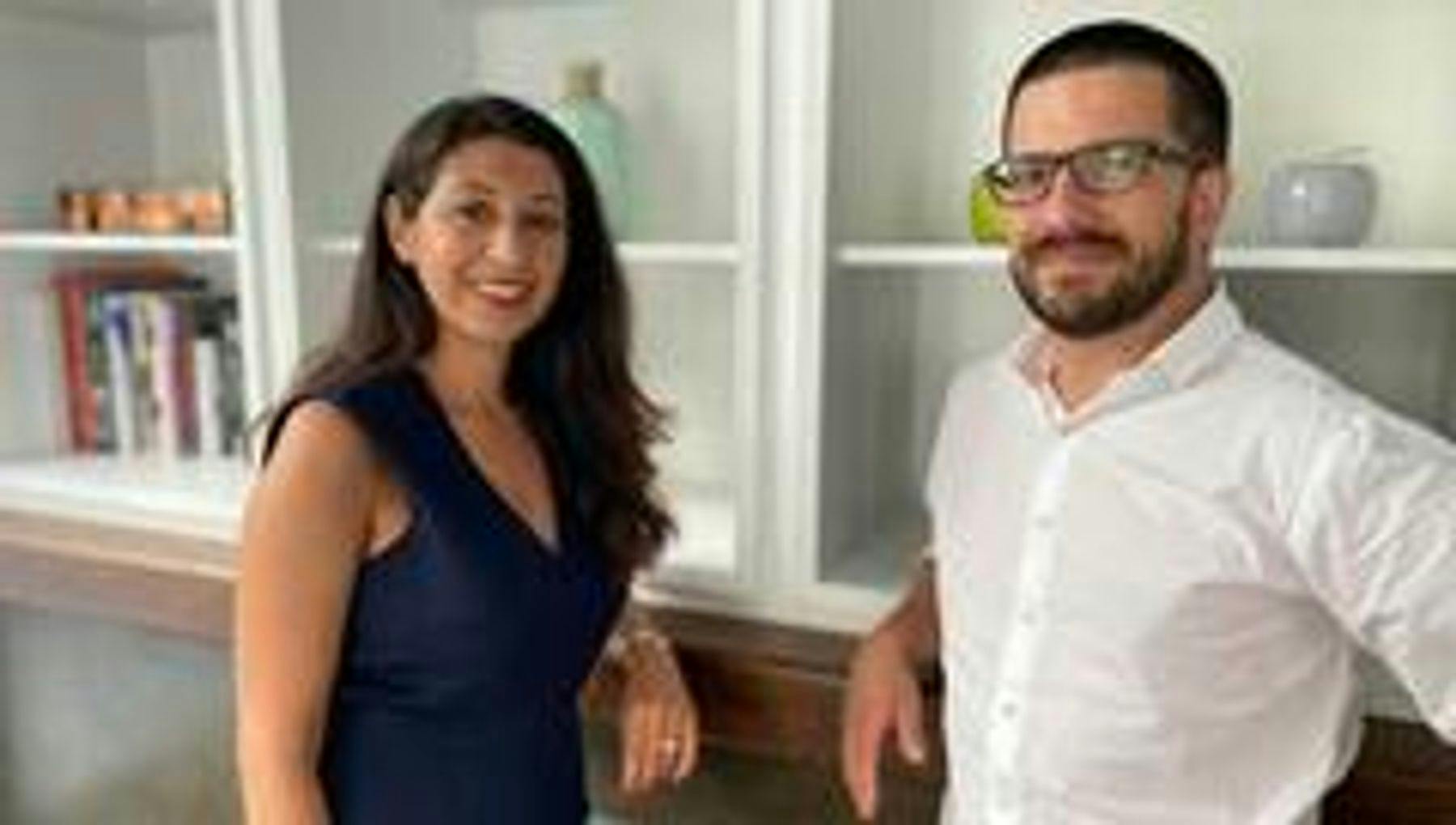 Portrait of Tradesnest founders Nancy Shenouda and Pierre Ouellette next to a cabinet.