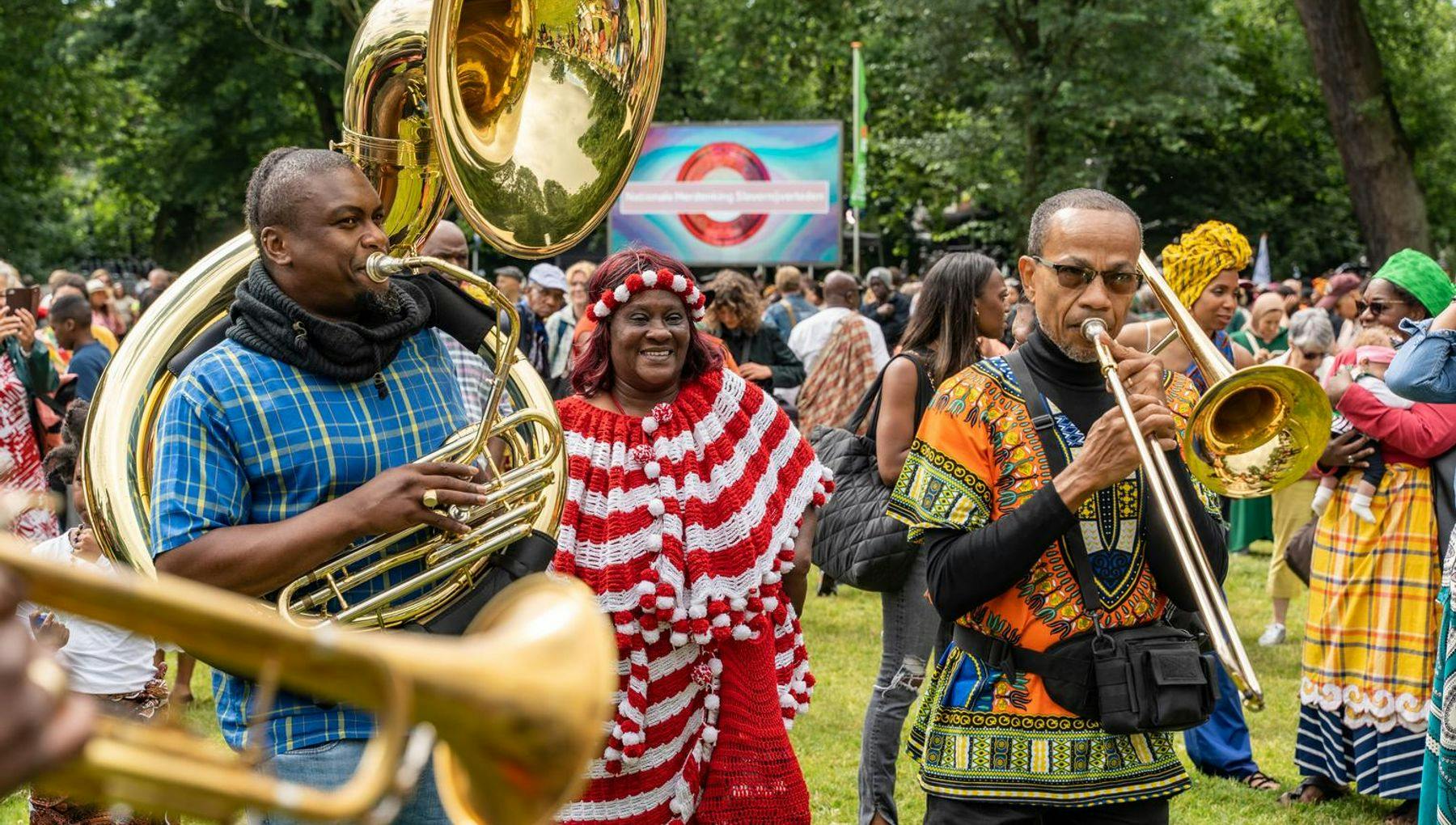 Musicians playing the trombone during Keti Koti Festival 2022 in the Oosterpark.