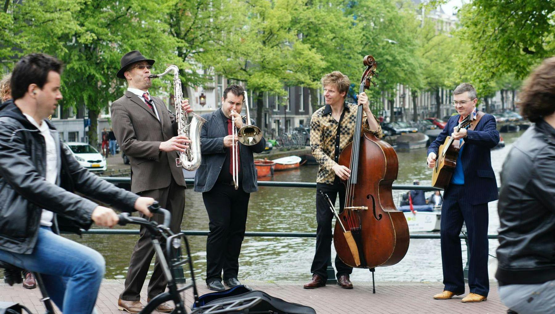 Jazz musicians playing on a bridge over the canal.