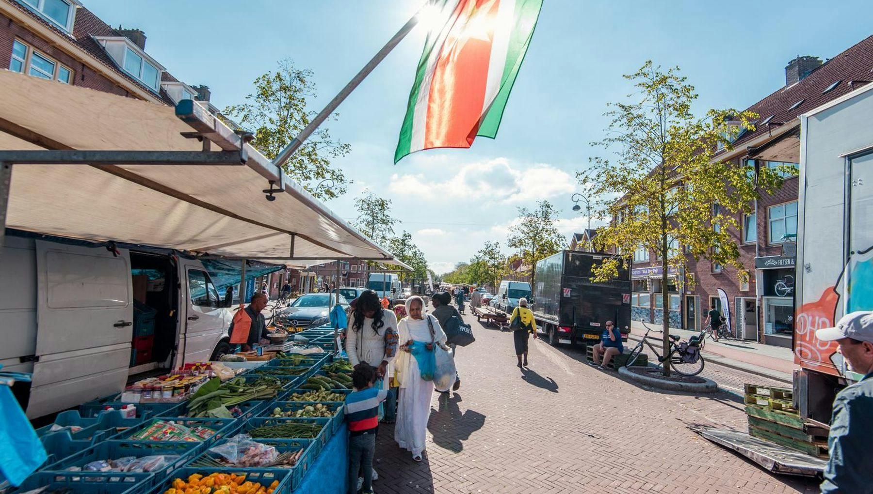 Van der Pekmarkt with Surinamese flag and fruit and vegetable stalls