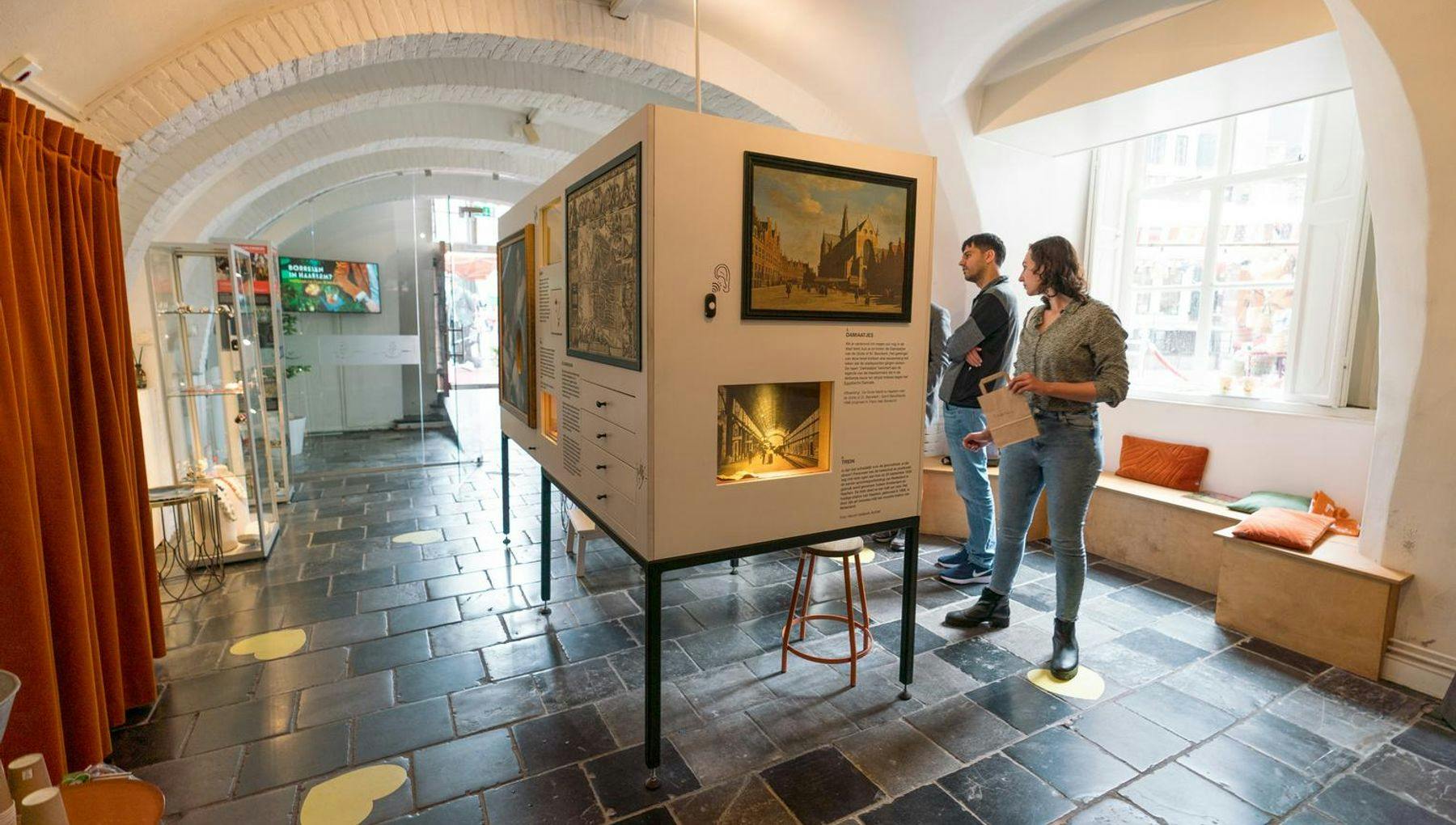 People visiting the exposition of the visitors centre Anno Haarlem about the history of city