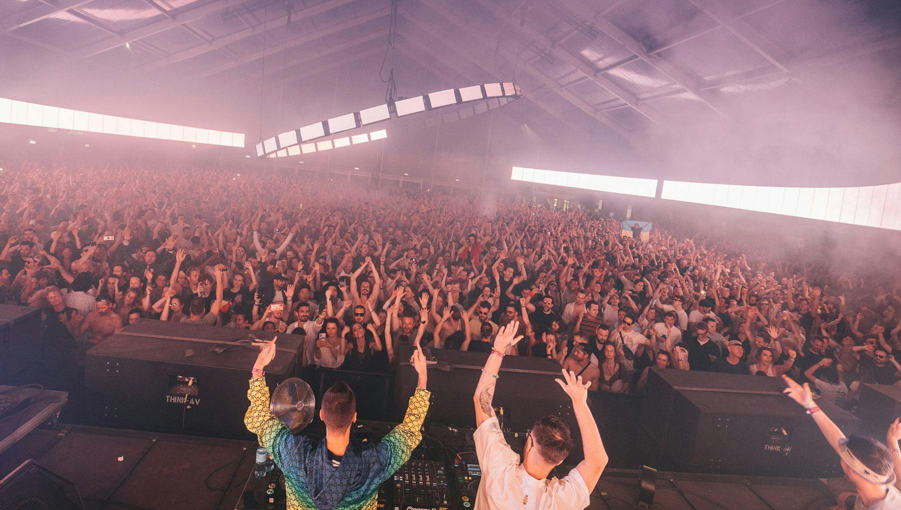 DJ's with their hands in the air during DGTL Festival 2022