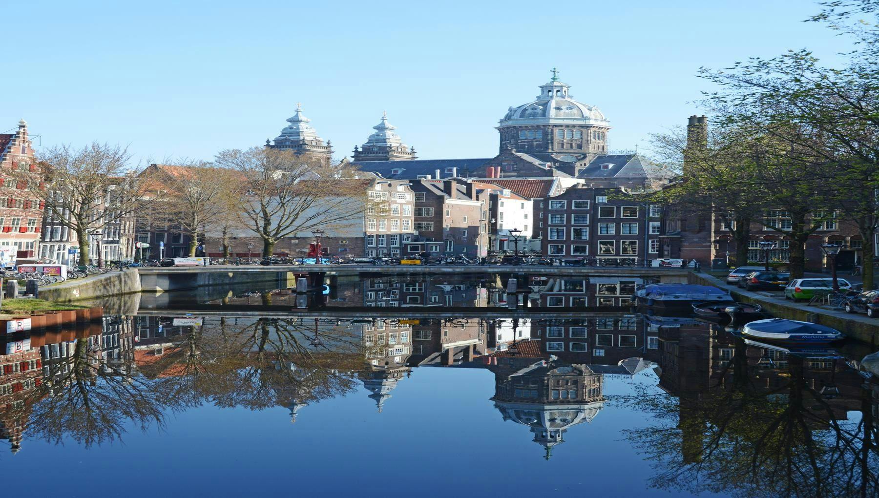 View of the Sint Nicolaaskerk building over the canal at spring