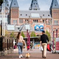 People walking outside Rijksmuseum at Museumplein