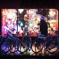 man in rain by bikes