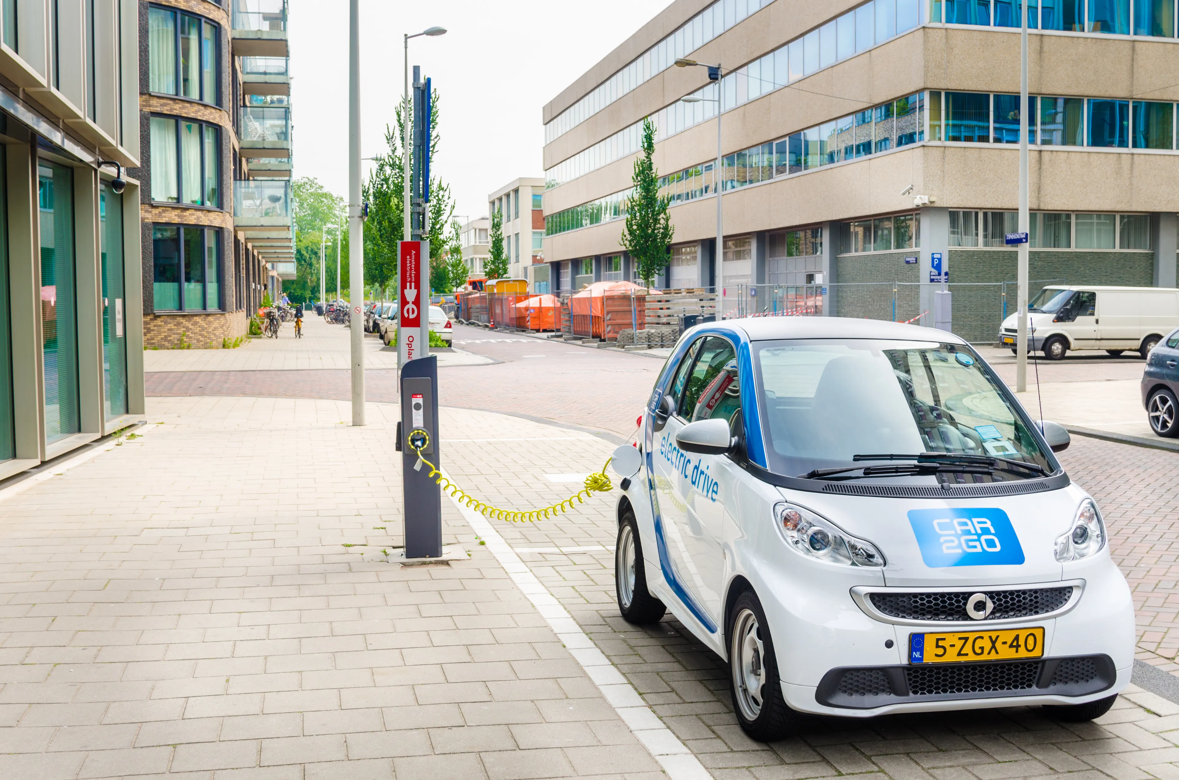 Amsterdam, The Netherlands - June 12, 2016: Car2Go Electric Car being Charged. Car2go is carsharing service available in Europe and North America. The Cars are user-accessed via a smartphone app