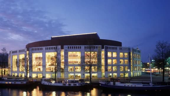 Stopera near Waterlooplein from the otherside of the river by night