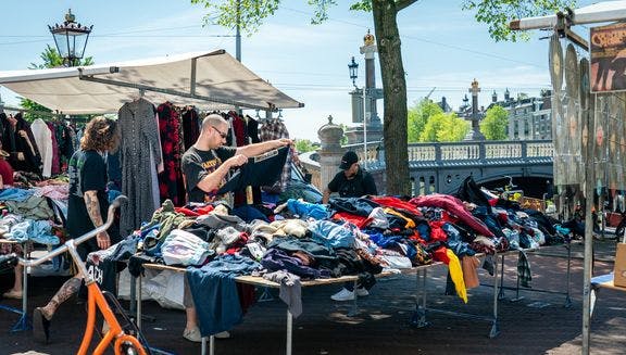 A second-hand clothing market stall at the Waterlooplein flea market.