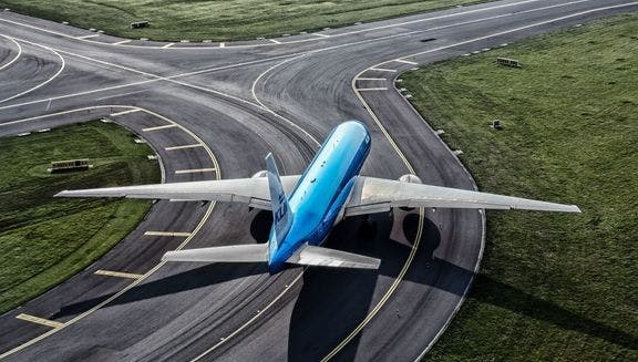 KLM Boeing 777 airplane on the runway at Schiphol Airport.