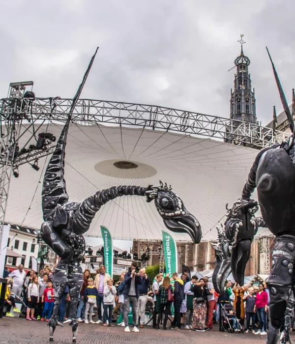 Grote Markt, Haarlem, Haarlem Culinair. Performers and art installations with visitors enjoying food at drinks at Haarlem Culinair food festival at the Grote Markt