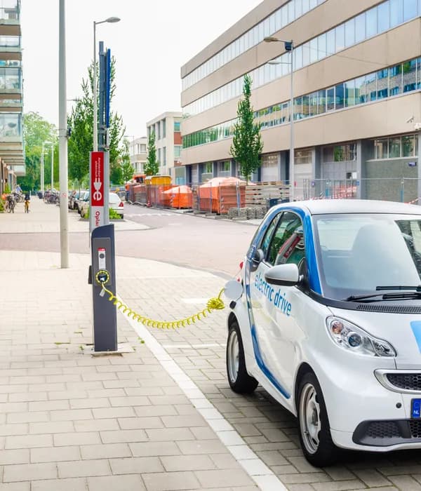 Amsterdam, The Netherlands - June 12, 2016: Car2Go Electric Car being Charged. Car2go is carsharing service available in Europe and North America. The Cars are user-accessed via a smartphone app