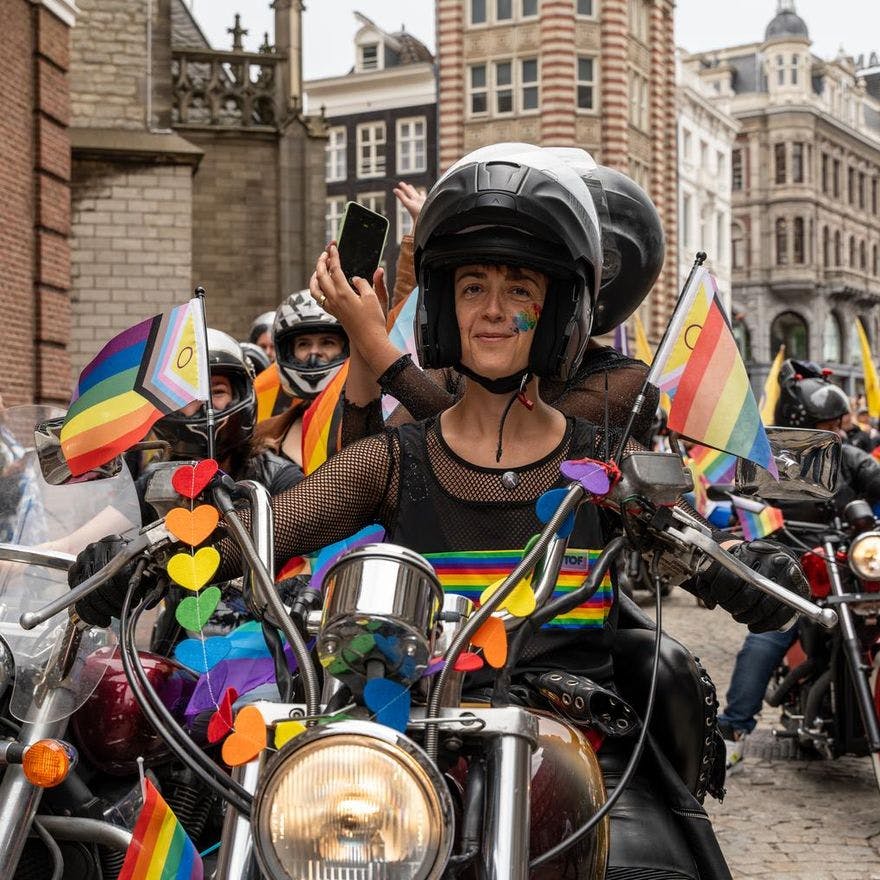 People on with rainbow colors decorated motorcycles during the Queer Walk 2023.
