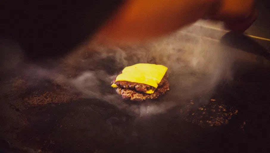 Rotisserie restaurant cheeseburger on the grill