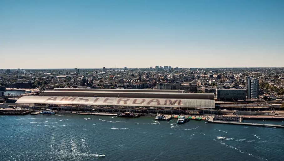 Summer skyline photo showing Amsterdam centraal station and views over the city