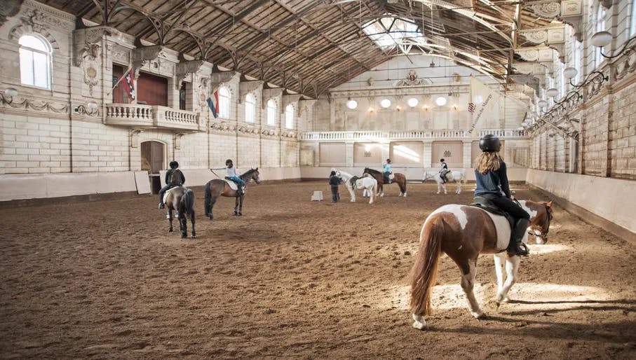 Child horse riding at Hollandsche Manege riding school