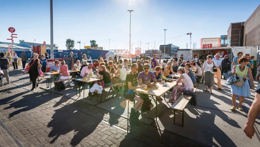 Over het IJ Festival 2019 people sitting in the food area