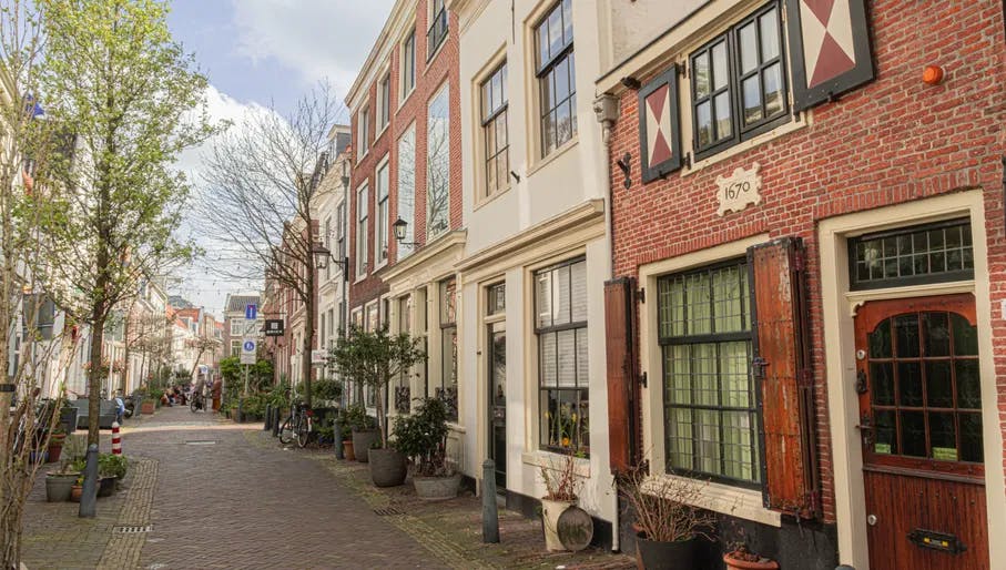 Historic houses and buildings on cobbled side street. Restaurant Brick. Haarlem Content Creation Day March 2024