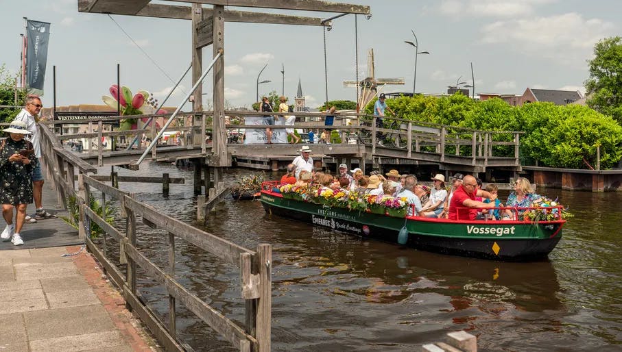People on a boat tour on the Westeinderplassen lakes near Aalsmeer.