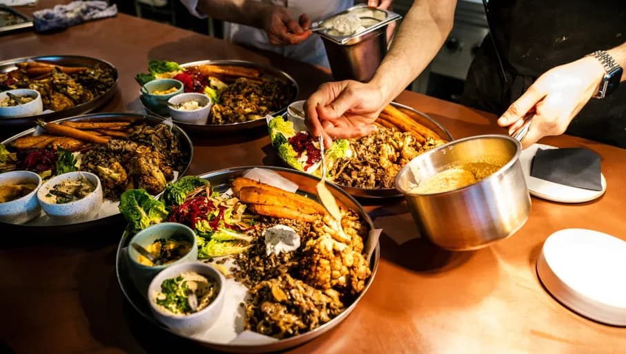 A Beautiful Mess chef preparing plates of food