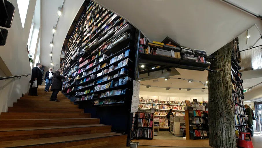 The American Book Center interior with bookshelves and staircase