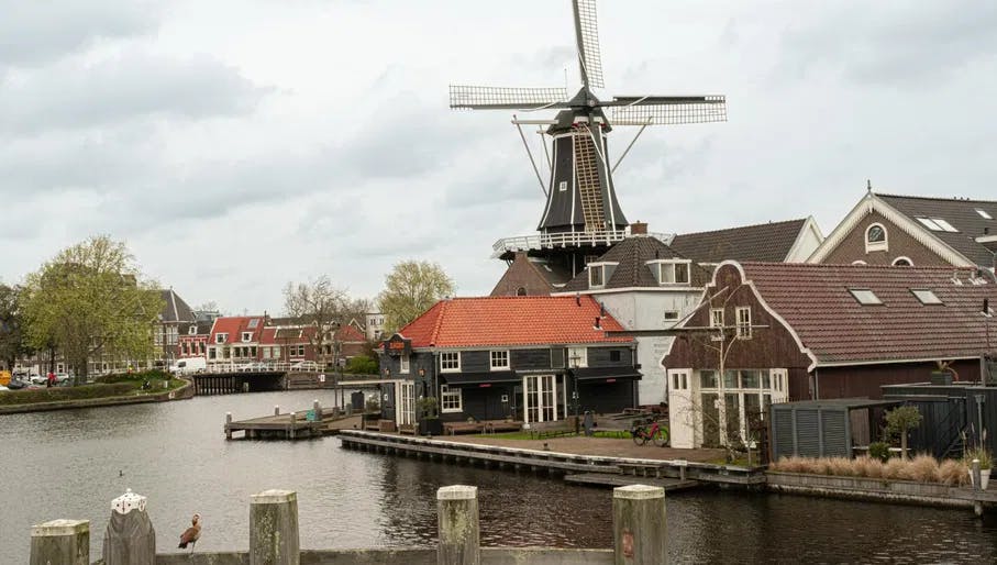Molen de Adriaan and terrace of Restaurant Zuidam on the banks of the River Spaarn. Haarlem Content Creation Day March 2024