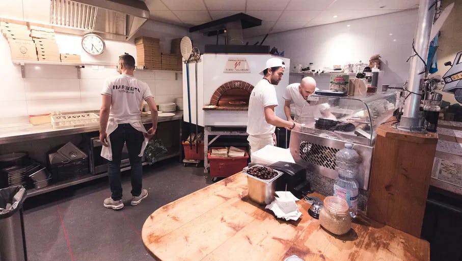 Chefs in the Margherita Tutta La Vita pizza kitchen