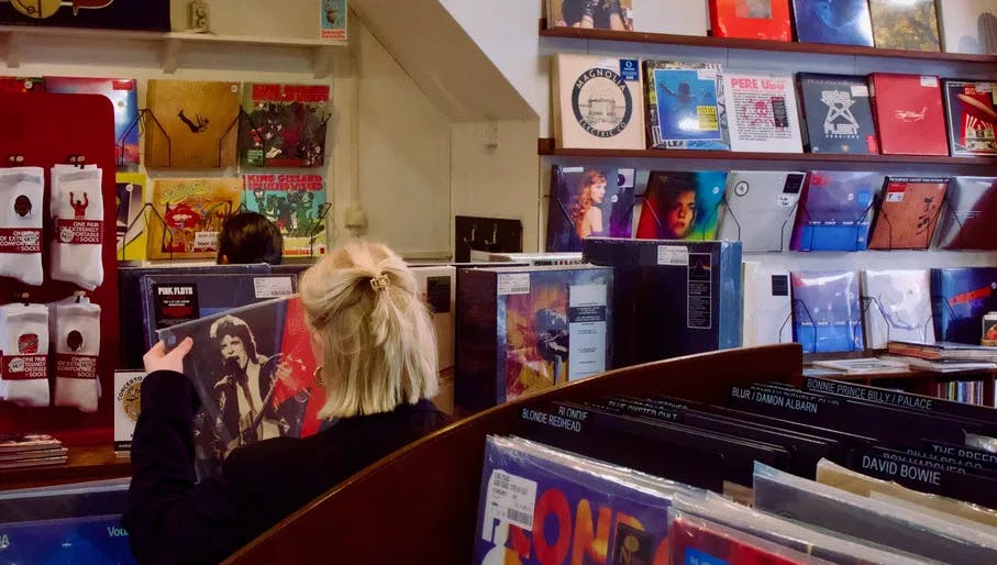 girl looking at vinyl inside concerto records shop