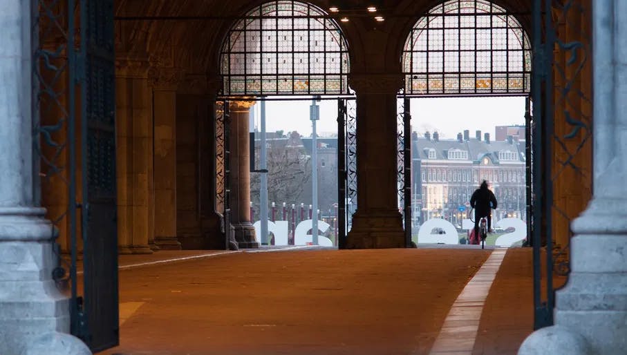 Cycling through the bike tunnel under the Rijksmuseum at museumplein