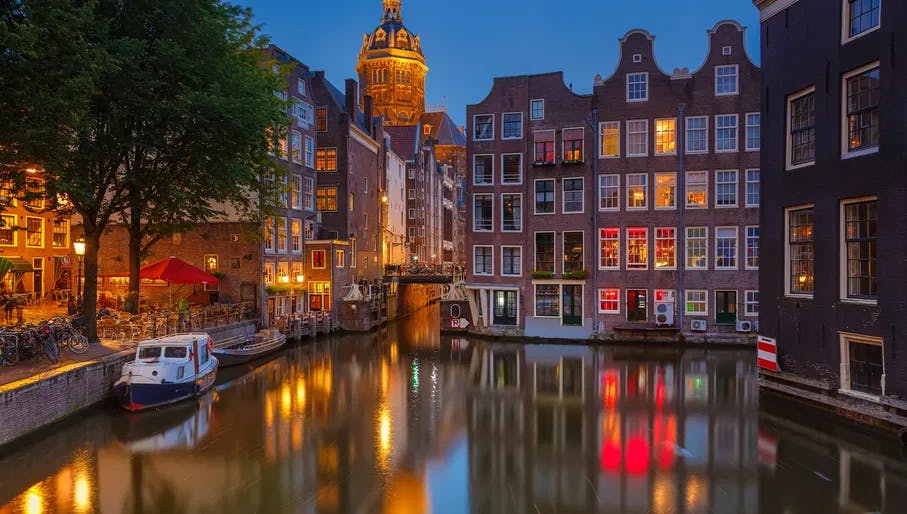 Amsterdam at night
126414503
Amsterdam Red Light District Armbrug at night with canal. Via Shutterstock
