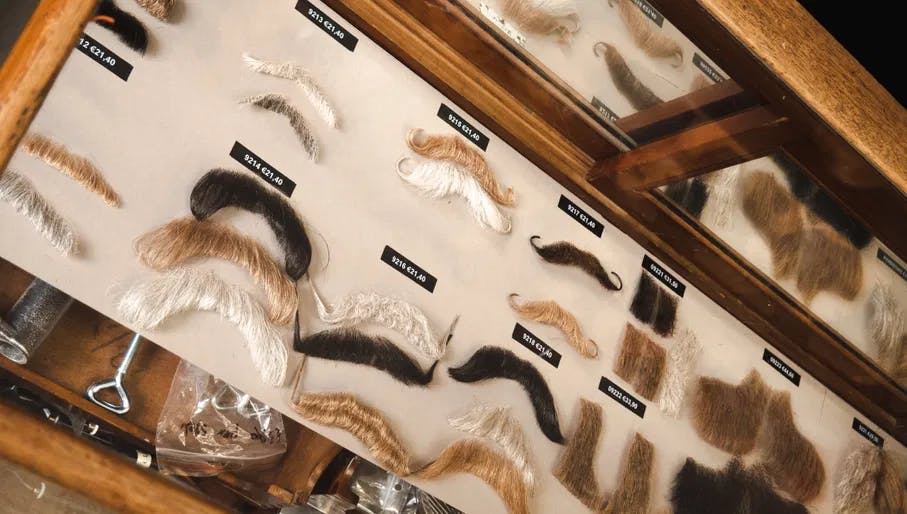 Wigs and moustache products in the interior of Back Stage beauty store